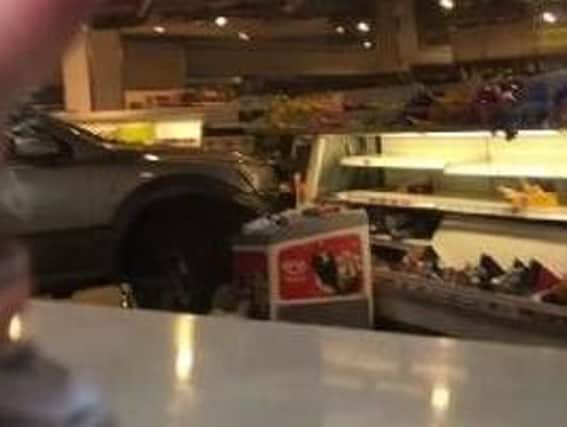 The car ploughed right into Sainsbury's in Crawley