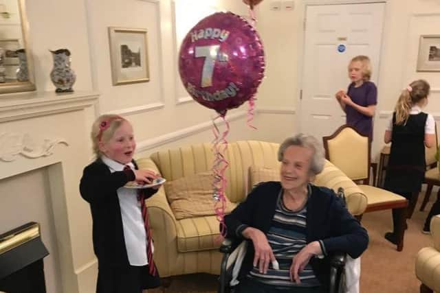 Madge Colbourne celebrating her birthday at home with her grea -granddaughter Madelaine who turned seven on the same day