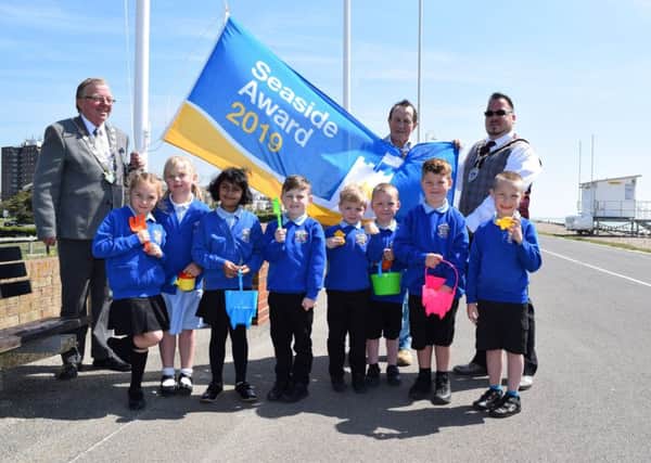 Former Arun District Council chairman Alan Gammon, Arun councillor James Walsh and the then-Littlehampton mayor Billy Blanchard-Cooper with school pupils at the flag raising ceremony on Littlehampton beach in May