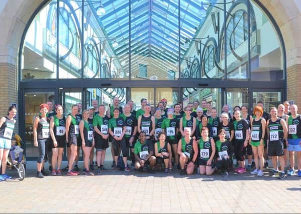 The Hastings Runners contingent outside Priory Meadow Shopping Centre ahead of the club's five-mile race