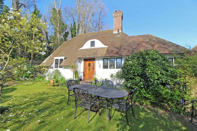 This three bed detached home is full of character and is in a unique location with direct access to the woodland. It is on for 499,950.