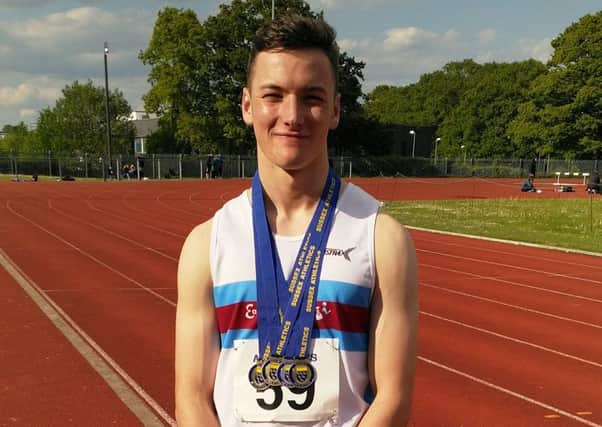 Pyers Lockwood with his medals from the Sussex Track & Field Championships
