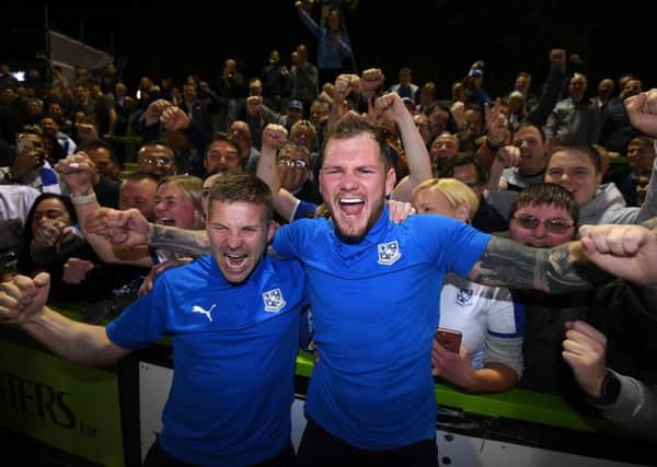 NAILSWORTH, ENGLAND - MAY 13: Jay Harris of Tranmere Rovers (L) celebrates with James Norwood of Tranmere Rover during the Sky Bet League Two Play-off Semi Final Second Leg match between Forest Green and Tranmere Rovers at The New Lawn on May 13, 2019 in Nailsworth, United Kingdom. (Photo by Harry Trump/Getty Images) SUS-190516-111810002