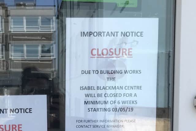 Signs on the door of the Isabel Blackman centre in South Street
