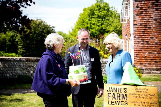 Cake ... founders Tish and Jamie Feilden with the Duchess of Cornwall. Image: Sophie Mitchell Photography