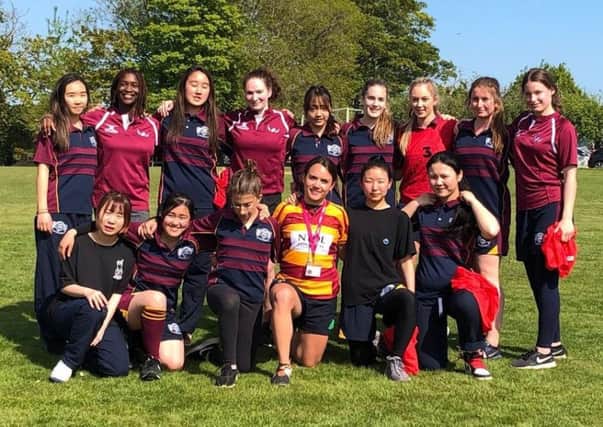 Buckswood School's girl rugby players with Harlequins Ladies star Ellie Miles