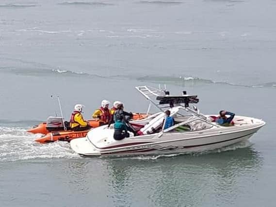 Shoreham lifeboat saving stricken speedboat