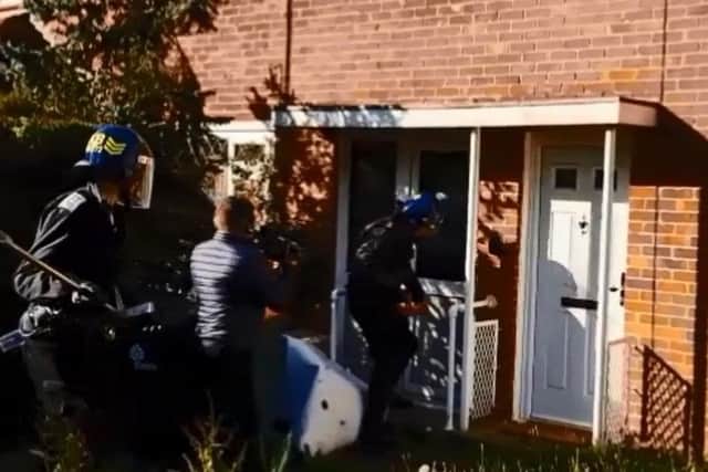Officers raided a Crawley home on Thursday