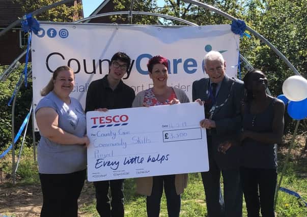 Pictured are: Shola Koyiki, Carl Calway and Faye Foster, Lisa Birch from Tesco, Cllr David Powell and Councillors Martin Saunders and Jante Baird