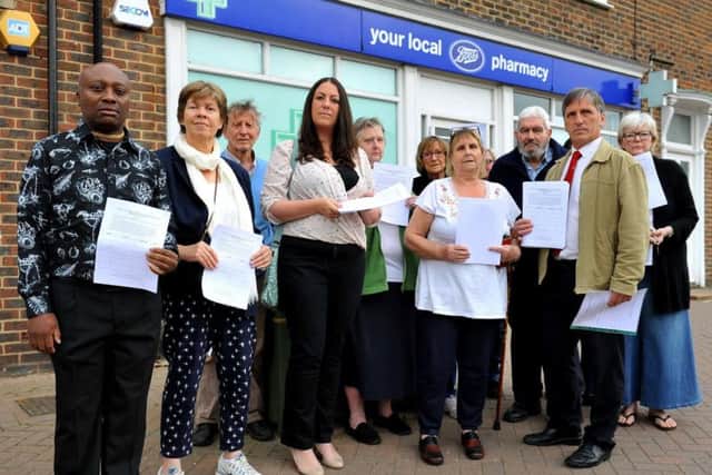 Upset Bentswood residents and councillors outside Boots Pharmacy in Haywards Heath. Photo by Steve Robards