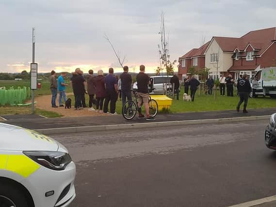 Residents and police on the Kingley Gate estate. Pic: Amber Banson