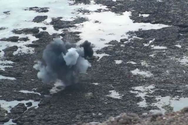 An unexploded shell being detonated at Beachy Head, still from video by Dan Jessup SUS-190521-160841001
