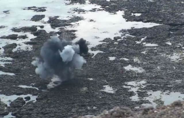 An unexploded shell being detonated at Beachy Head, still from video by Dan Jessup SUS-190521-160841001