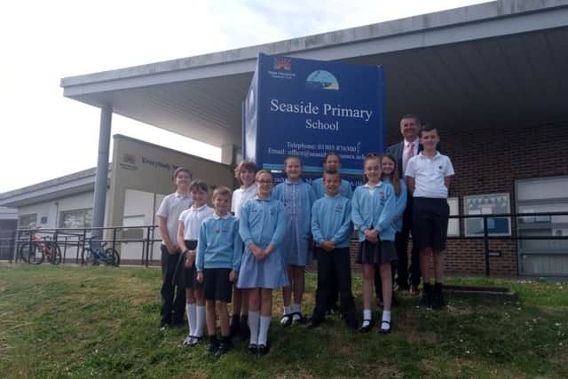 Headteacher Lee Murley with Year 6 prefects and pupils of Seaside Primary School SUS-190522-103744001