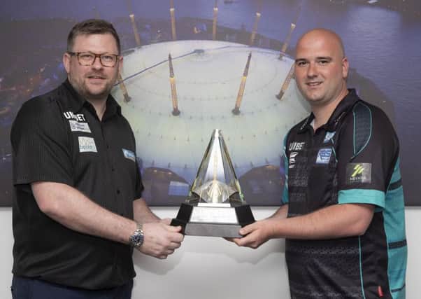 Rob Cross (right) and semi-final opponent James Wade with the Unibet Premier League trophy. Picture courtesy Lawrence Lustig/PDC