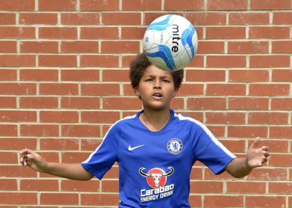 Ola Ademola (12) who lives at The South Harbour, Eastbourne has been given a two year contract with Chelsea FC (Photo by Jon Rigby) SUS-190523-103902002