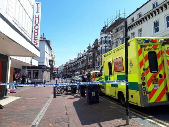 Emergency services on scene outside TJ Hughes in Seaside Road, Eastbourne town centre SUS-190523-121139001