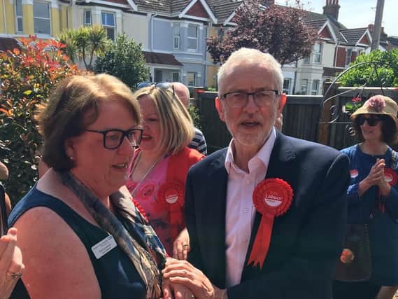 Jeremy Corbyn congratulates and thanks Pat Schan for her 45 years of service as a nurse and midwife for the NHS