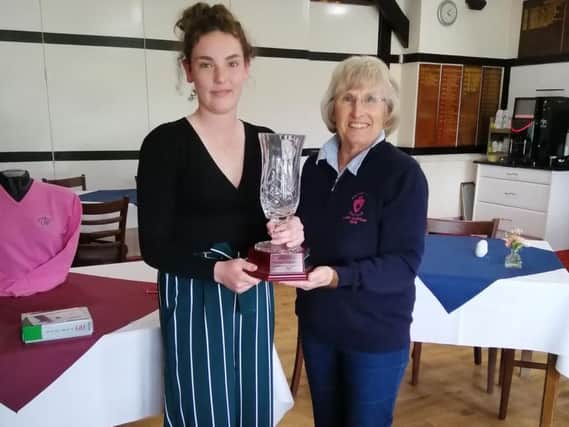 Bognor's Katie Field receives her prize in the Sussex girls masters event at her home course