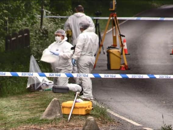 Forensic teams working at the site