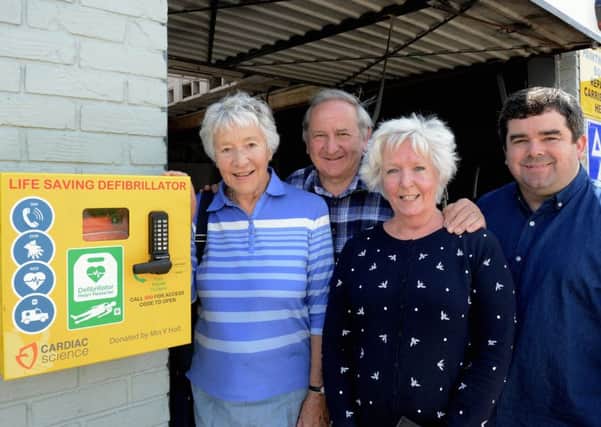 Val Holt, Alyn Miller, Sue Miller and Steve Carruthers with the new defibrillator in Pagham