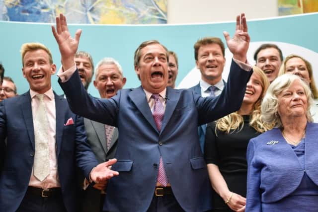 Brexit Party leader Nigel Farage speaks to the media as he stands with newly elected Brexit Party MEPs. (Photo by Peter Summers/Getty Images)