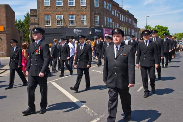 Mark's son, Adam leading the way at the funeral procession in Haywards Heath, proudly wearing his medals. Photo by Eddie Howland