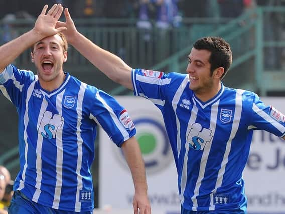 Glenn Murray and Gary Dicker celebrate a goal during the 2010/11 season. Picture by Getty Images