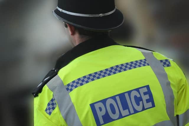 A man has been charged after a woman was knifed in the face in Brighton