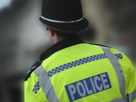 A man has been charged after a woman was knifed in the face in Brighton