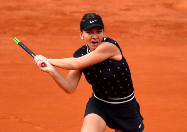 PARIS, FRANCE - MAY 28: Simona Halep of Romania plays a backhand  during her ladies singles first round match against Ajla Tomljanovic of Australia during Day three of the 2019 French Open at Roland Garros on May 28, 2019 in Paris, France. (Photo by Clive Mason/Getty Images) SUS-190530-101832002