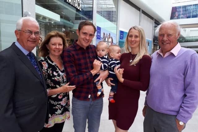 Colin and Sharon are pictured with son Mark, his wife Hannah, the couple's baby twins Oliver and Freddie and centre manager Bill Plumridge SUS-190530-102121001
