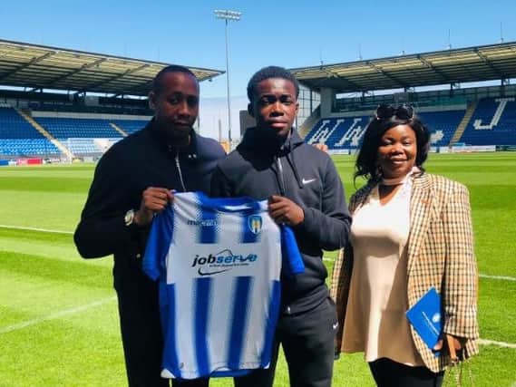 Kwame Poku (centre) left Worthing to sign a professional contract at Colchester United earlier this month