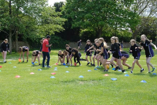 Groups played games on the field as part of the day with Ashok Rathod