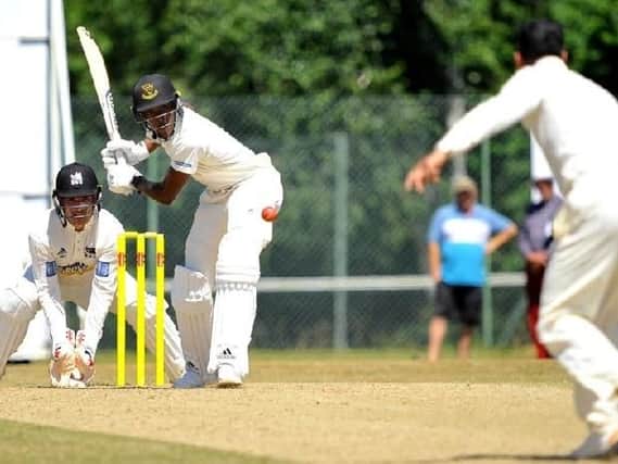 Roffey's Rohit Jagota bowls to Horsham's Jofra Archer in last year's game at Cricketfield Road. Picture by Steve Robards