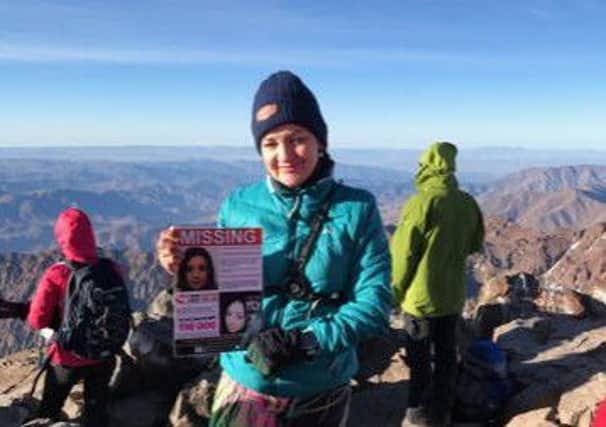 On Sunday, May 19, Andrea Gharsallah scaled the summit of Mount Toubkal in southwestern Morocco and posed for a photo with one of the posters of her missing daughter Georgina Gharsallah