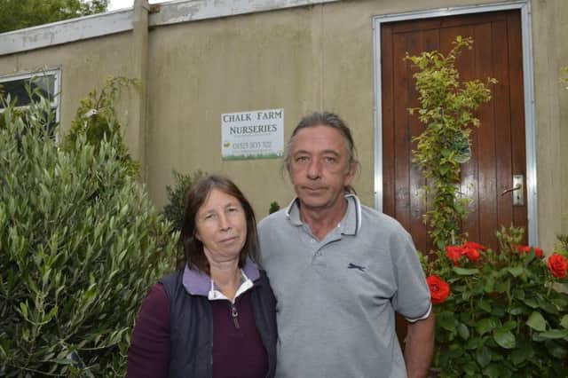 Sue and Graeme Dunlop at Chalk Farm Nurseries where a charity box for children with cancer has been stolen (Photo by Jon Rigby)