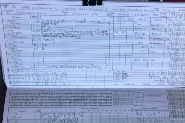 The scorebook shows Tim Singer's incredible innings