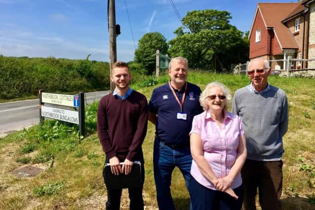 Joe Osborne, representing Peter Bottomley MP, county councillor Sean McDonald, Worthing Borough councillor Jane Sim and Barry Burks on the spot where the footpath will be next to Titnore Lane