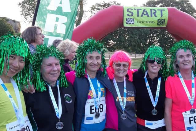 The Bridge Cafe Flyers (Hastings Runners vet ladies) team which won the best dressed team award thanks to their flamboyant coloured wigs. From left: Manami Cheves, Janice Young, Jane Hughes, Debra Van Aalst, Helen Brown, Susan Rae.
