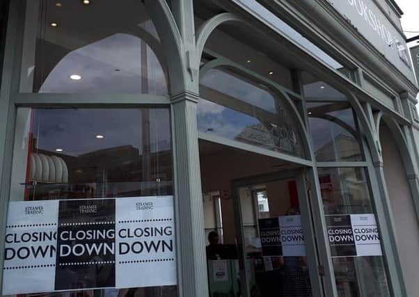 Closing down signs in the window of Steamer Trading in Cornfield Road, Eastbourne