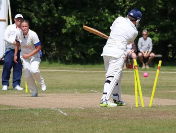 Naomi Woods takes a wicket. Picture by Mark Peacock