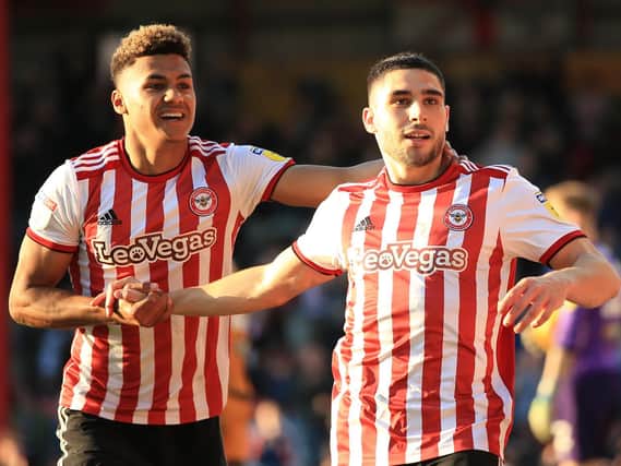 Brentford's Ollie Watkins and Neal Maupay celebrate a goal last season. Picture by Getty Images