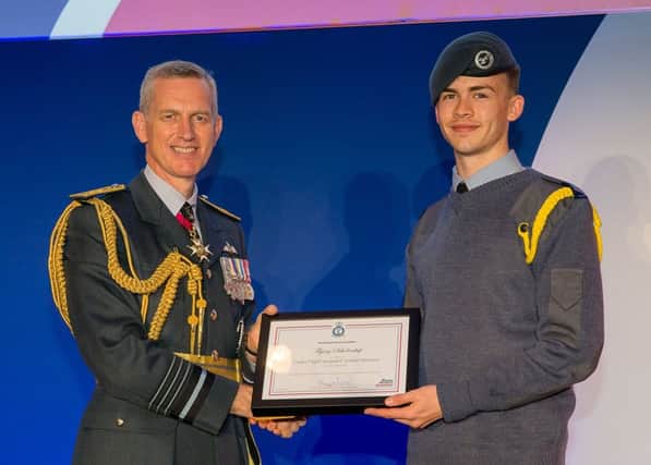 Cadet Corporal Joe Stevens receives his Flying Scholarship from Air Chief Marshal Sir Stephen Hillier at the RAF Association conference SUS-190406-100019001