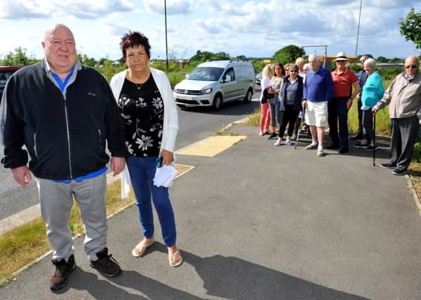 Residents at Highwood Mill retirement properties in Horsham are campaigning to get new traffic lights installed so they can travel to Wickhurst Green. Anthony and Linda Bridger. Pic Steve Robards SR1913841 SUS-190406-093944001