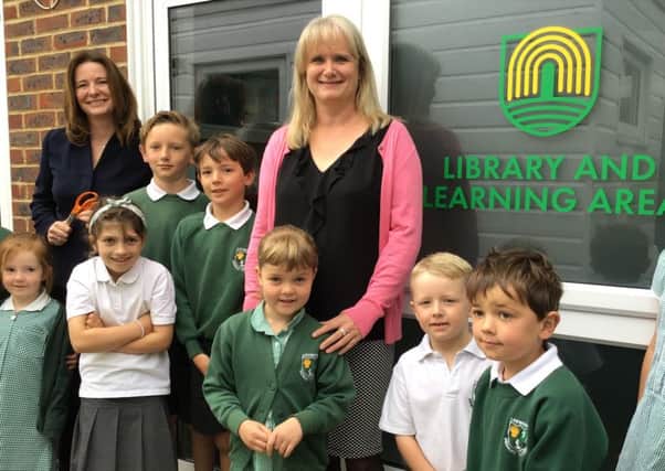 Loxwwod Primary School pupils and MP Gillian Keegan at the opening of the library SUS-190406-145115001