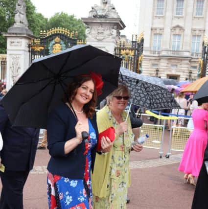 Joanna Barden, centre manager, and Kate Henshaw, vice-chairman of trustees, outside Buckingham Palace