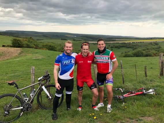 Left to right: Rob Fenwick, Jamie Tyson and Alex Lord at Ditchling Beacon during a recent training ride