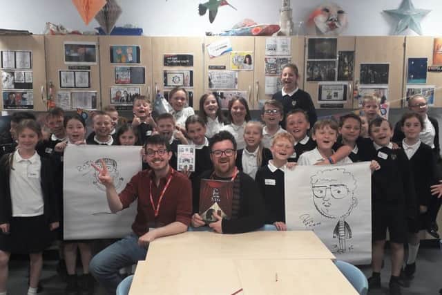 Author Ross Montgomery and illustrator David Litchfield with pupils at Glebe Primary School