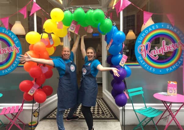 Staff stood proud in the balloon arch